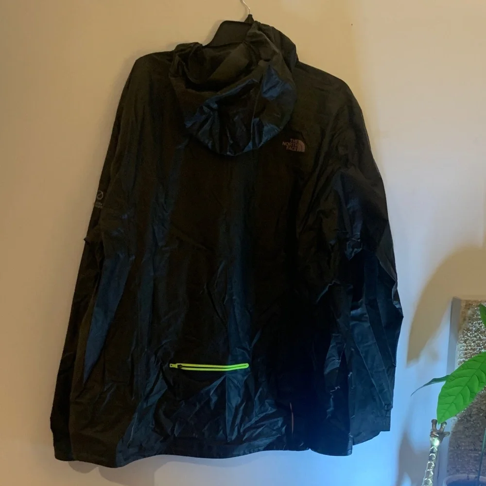 The North Face Men's Black Raincoat with Bright Yellow Zipper
